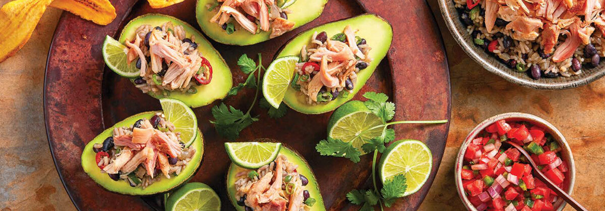 Gallo Pinto with chicken served in half an avocado with plantain chips