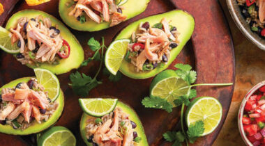 Gallo Pinto with chicken served in half an avocado with plantain chips