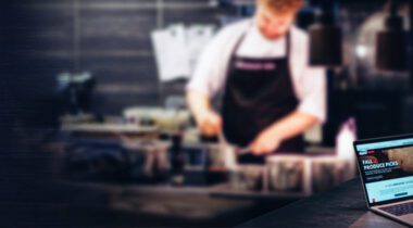 salesman on computer in kitchen