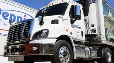 delivery truck in front of building