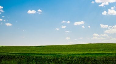 field and blue sky landscape