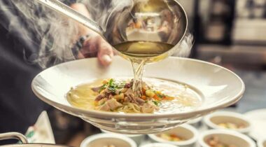 hot soup ladled into a bowl