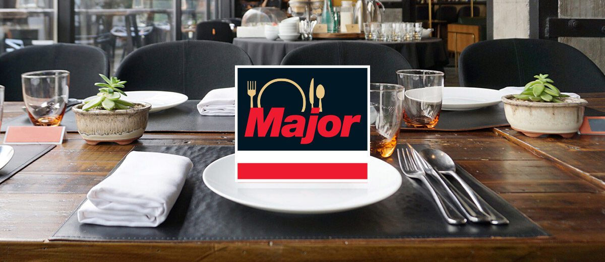 restaurant place setting with major products logo on a plate