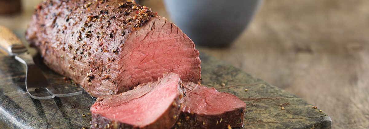 cooked beef tenderloin on cutting board