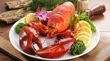 a cooked red lobster on a plate