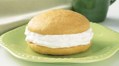 pumpkin flavored whoopie pie on a green plate